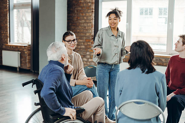 istock Diverse group of people participating in support group meeting 2226795560