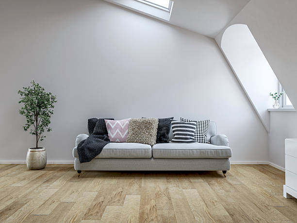 istock Front view of a Bright Scandinavian Loft Interior with Roof windows (skylight), sloped ceiling, Cozy Sofa and Decorative Cushions 2226795603