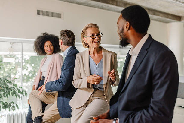 istock Team of professionals engaged in lively conversation 2226796013