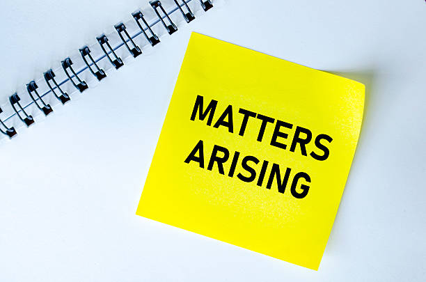 istock Matters Arising text on yellow notepad. Meeting agenda concept 2226796459