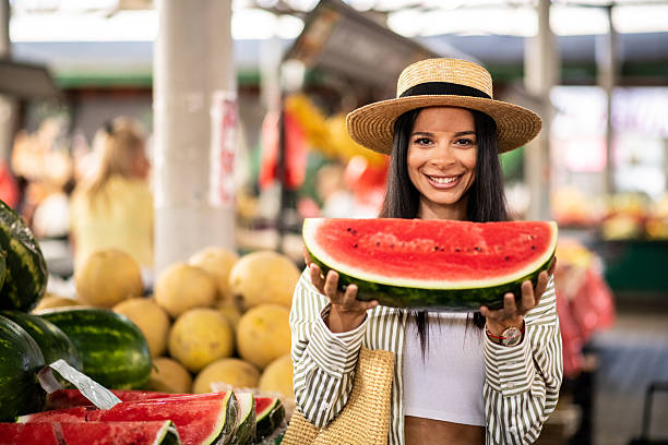 istock Stylish woman holding watermelon slice 2226797951
