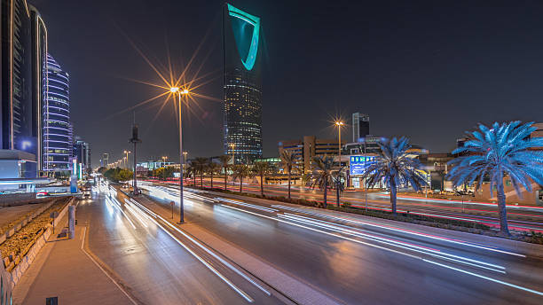 Panoramic aerial night timelapse of Riyadh featuring highway traffic, Kingdom Tower. Saudi Arabia
