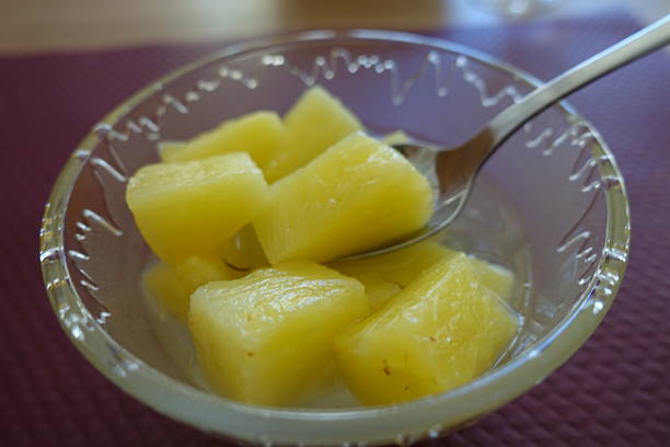 istock Portioned pineapple in syrup served in a glass fruit bowl 2226801946
