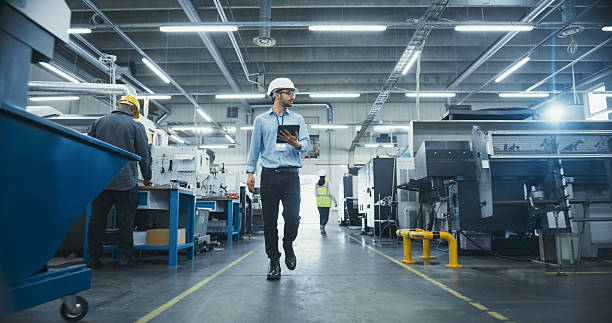 istock Chief Technical Officer Working at Metal Components Production Factory. Young Middle Eastern Specialist Walking in the Facility, Using Tablet Computer to Monitor the Manufacturing Process 2226804505