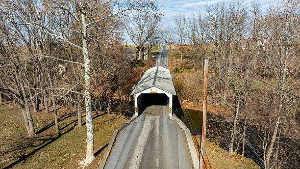 istock Covered Bridge Surrounded by Trees in Rural Area During Autumn Morning 2226805784