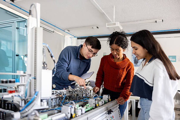 istock Robotic students discussing ideas about the operation of a production line robot 2226813093