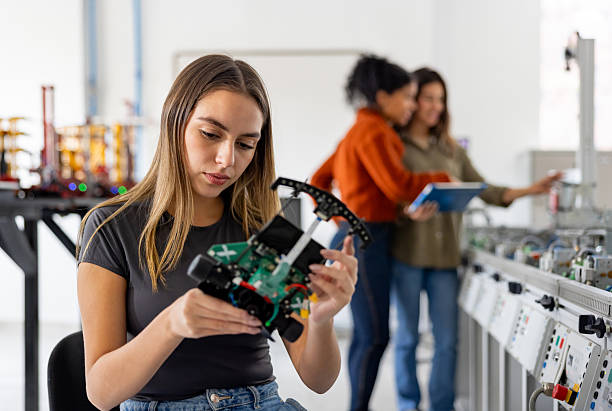 istock Female student building a robot in a STEM class 2226813151