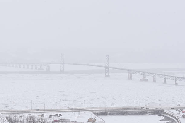 Foggy winter landscape with a bridge in Quebec, Canada.