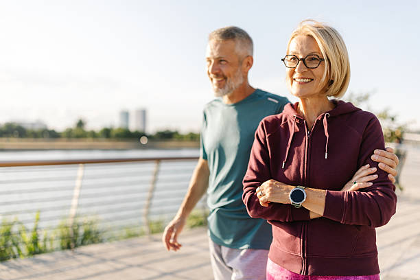 istock Happy couple walking along the riverside path 2226814946