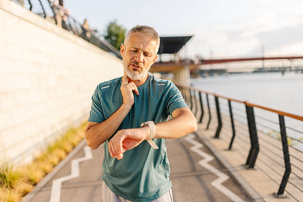 istock Man Checking Smart Watch by the River 2226816353