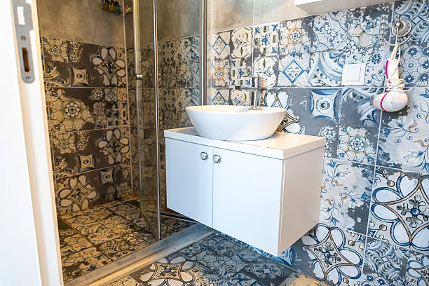 istock Modern bathroom with patterned tiles and stylish fixtures in bright lighting 2226817323