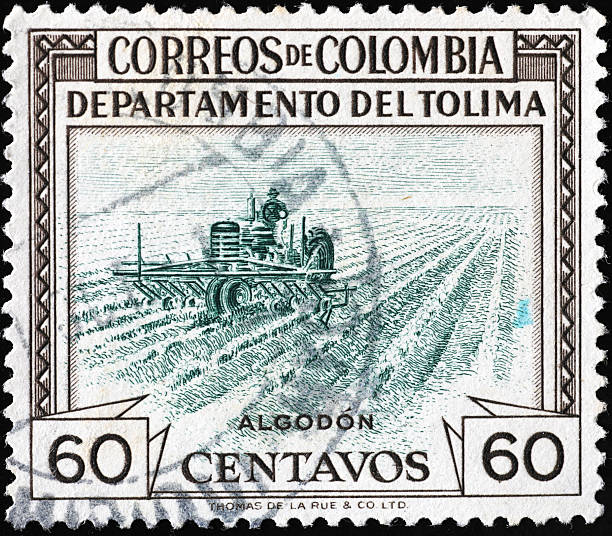 Farmer working in a field on stamp from Colombia