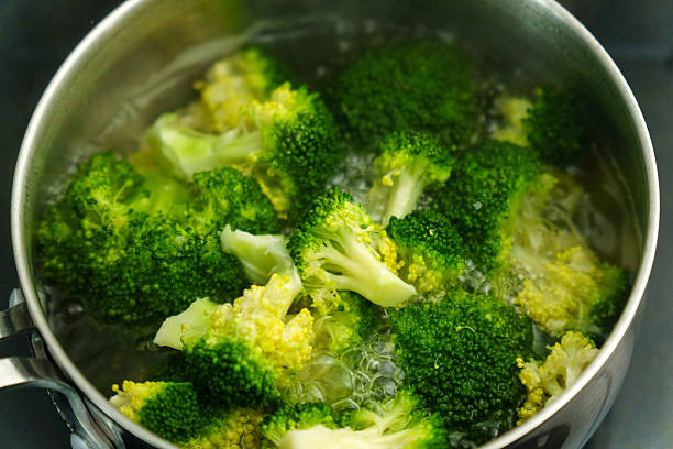 istock Cooking fresh broccoli in a saucepan over medium heat during a sunny afternoon 2226818895