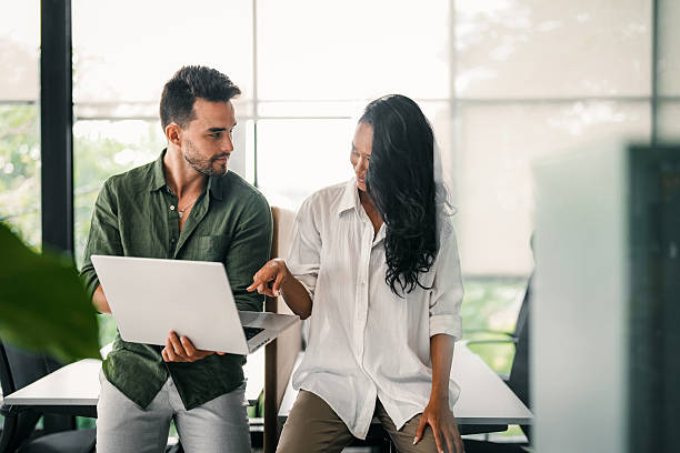 istock Group of young multi-ethnic startup business team collaborating on project in modern office 2226822612