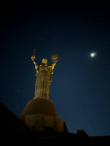 Kyiv, Ukraine - April 3, 2025: Stars shine on a clear night behind the Mother Ukraine monument in Kyiv. Opened in 1981 and originally called the Motherland Monument, the name was changed to Mother Ukraine in 2023.