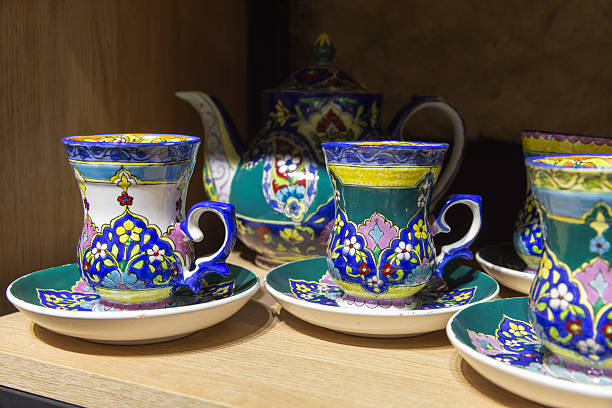 istock Elegant and Colorful Ceramic Tea Set Displayed on a Wooden Shelf 2226825970
