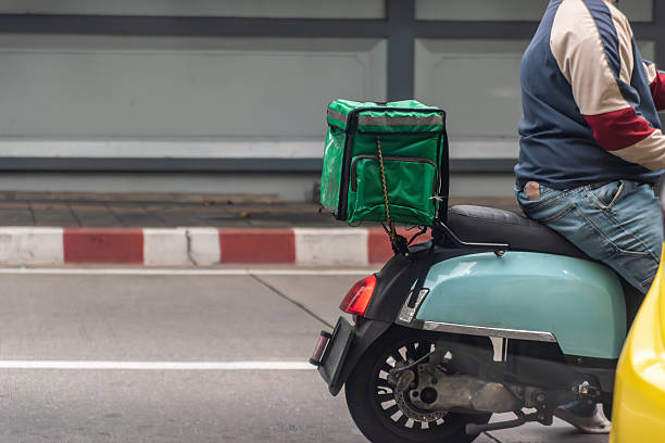 istock Scooter Delivery Service on City Street 2226828267