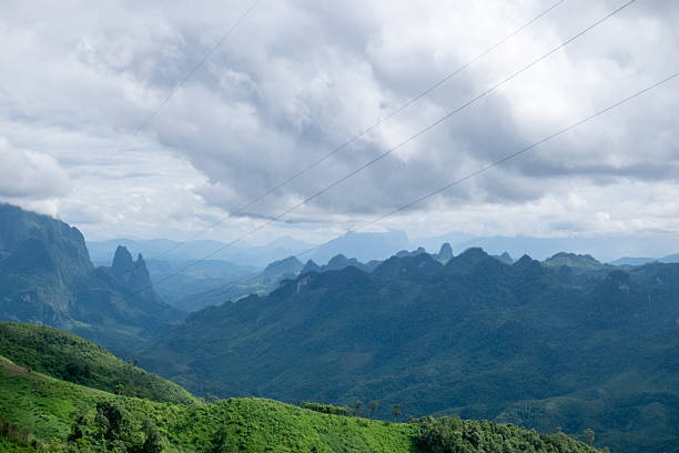 Misty Mountains and Town at Dusk in Laos. High quality photo