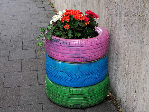 istock flowers inside colorful tires detail 2226830298