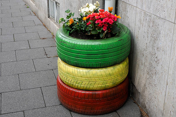 istock flowers inside colorful tires detail 2226830300