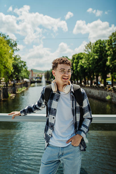 istock Young caucasian man student smiling and using smartphone 2226833310