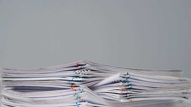 istock Time lapse of paper sheets on white background. Stop motion animation of half stack with many business files documents with clips. 2226833655