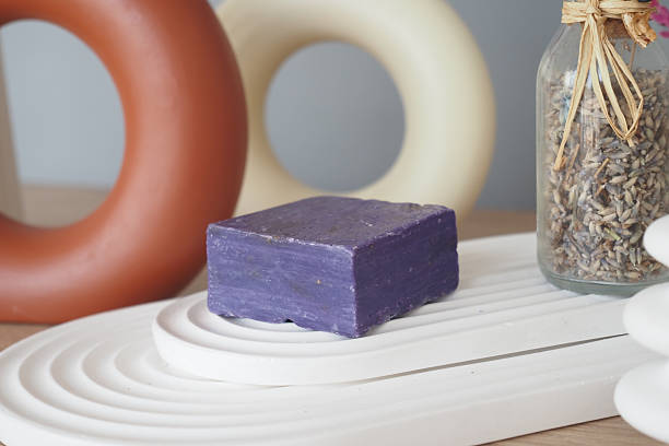 istock Natural lavender soap among decorative elements on a wooden surface 2226835677