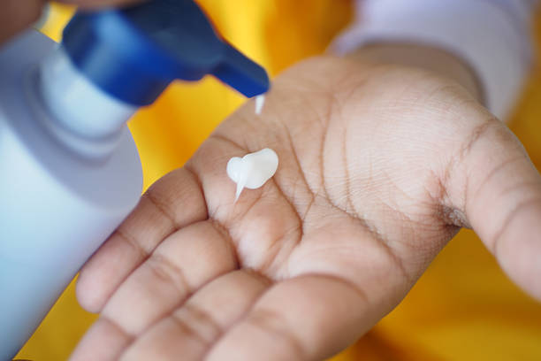 istock Applying lotion to child hand for hydration and skincare routine 2226835826