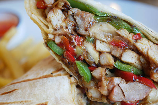 istock Delicious wrap filled with grilled chicken and fresh vegetables 2226837481