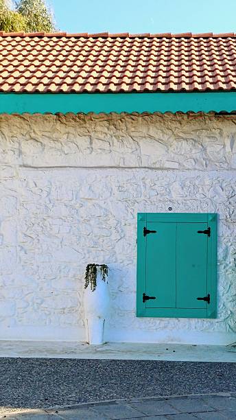 istock A white house with blue wooden shutters 2226839259