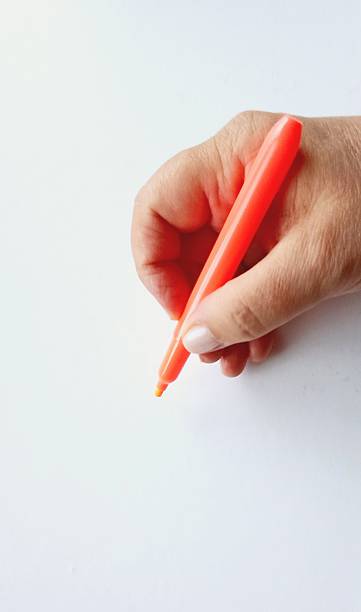 istock Colored pencil in a woman's hand. 2226839455
