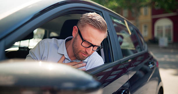 istock Young Male Passenger Struggles With Motion Sickness In Car 2226845729