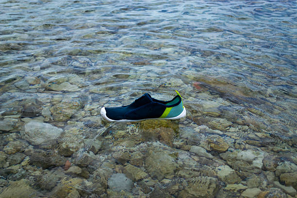 istock Lost Water Shoe in the Sea 2226846453