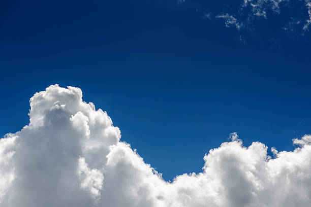 istock Bright White Clouds Set Against a Deep Blue Sky on a Sunny Day 2226847440