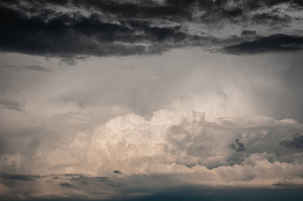 istock Sunlit Cumulonimbus Tower Under Dark Shelf Cloud 2226847649