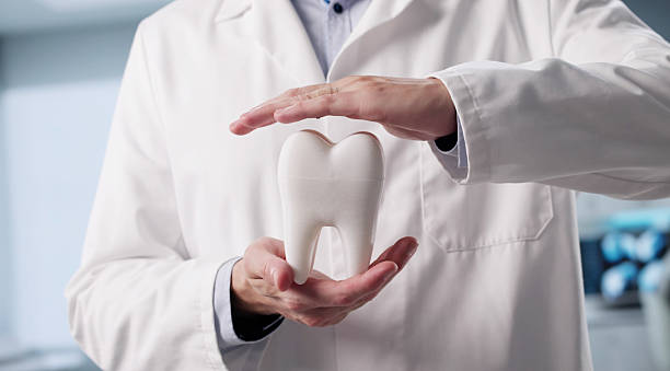 istock Smiling Dentist Ensures Healthy Teeth 2226849114