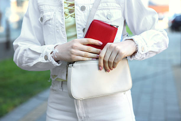 istock Woman putting purse into bag outdoors, closeup 2226850742