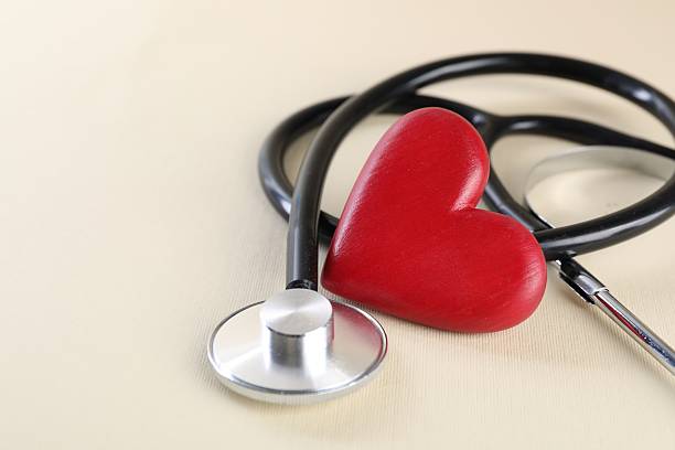 istock Stethoscope and red heart on beige background, closeup. Space for text 2226851550