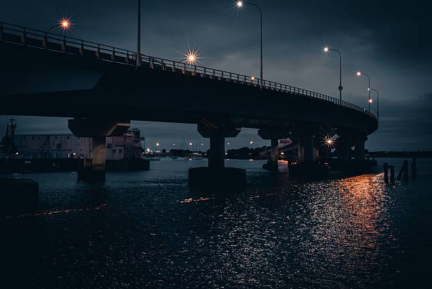 istock Moody Bridge Over River at Evening 2226851739