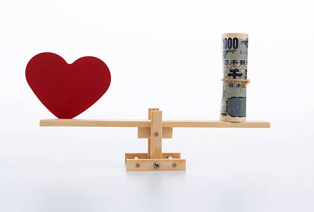 istock Seesaw with red heart and Japanese Yen 2226852009