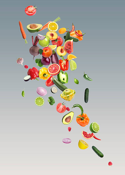 istock Different fresh fruits and vegetables in air on grey gradient background 2226852225