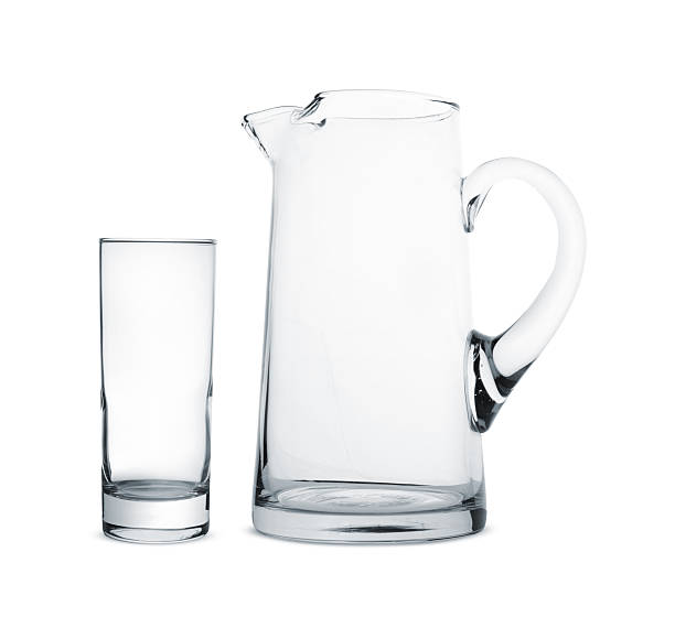 istock Empty glass and jug isolated on white 2226852233