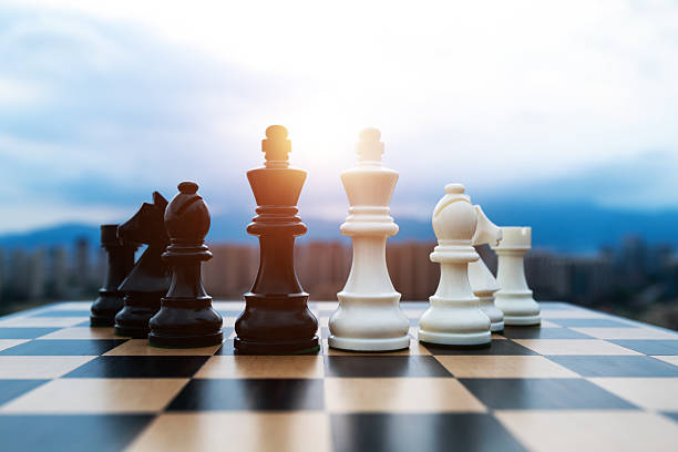 istock Black and white chess pieces on chess board 2226852492