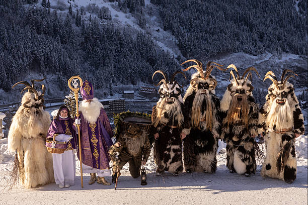 istock Traditional winter celebration features mythical figures in snowy mountain setting during daylight hours 2226853952