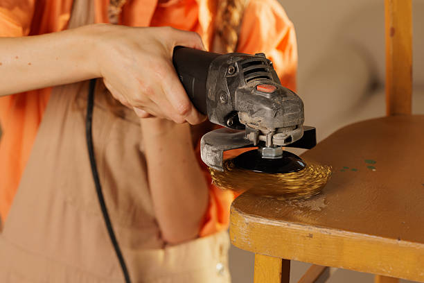 istock Hand Sanding Wooden Chair with Grinder during Restoration Process 2226854378