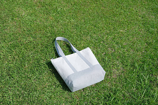 istock Mockup shopper handbag on green grass background 2226854630