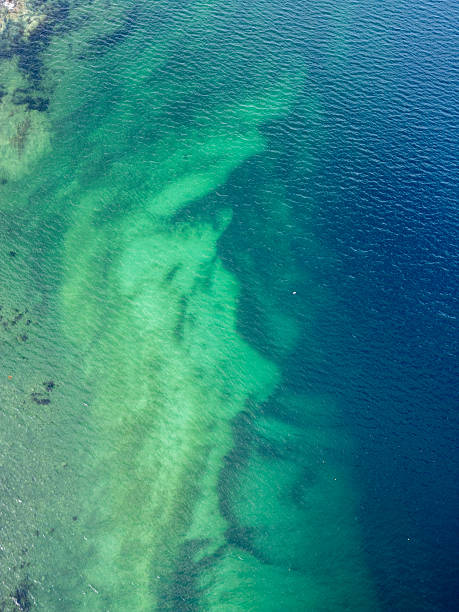 istock Vibrant Aerial Water Patterns: Crystal Clear Turquoise & Emerald Sea with Deep Blue Transitions - Abstract Nature & Serene Underwater Stock Photo 2226854679
