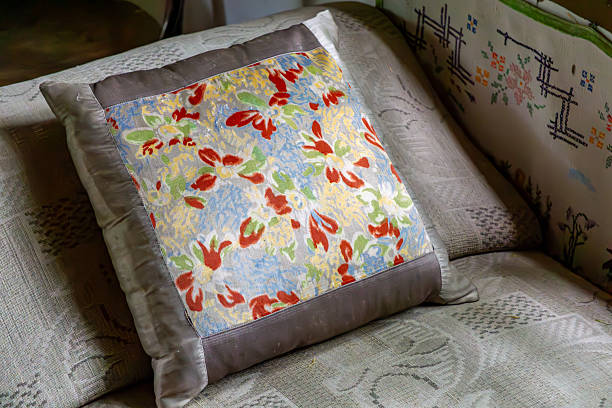 Cute cushions with colorful flowers on a sofa