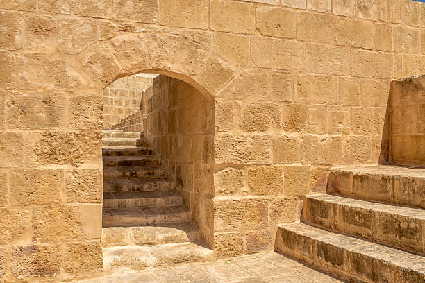 istock Sunlit Stone Stairway and Arch in Ancient Fortress 2226857679