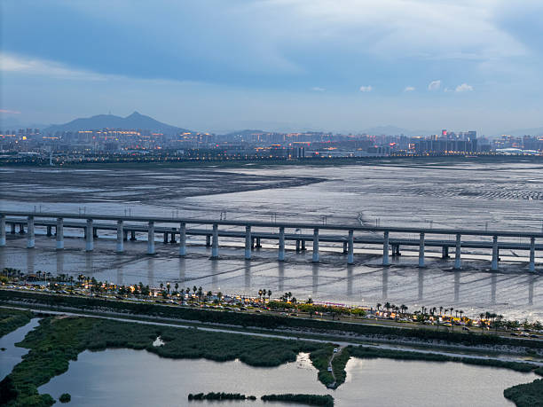 istock A panoramic view of a cityscape at dusk with a prominent bridge 2226858251